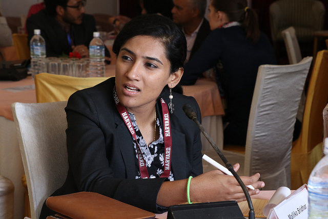 Woman at the training sitting and speaking.