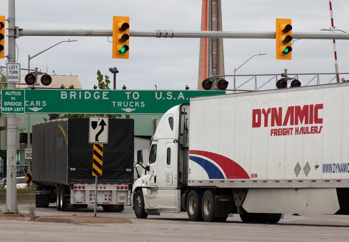 A white truck passes through an intersection